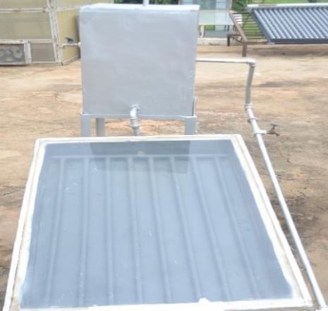 Flat-plate collector and storage tank for natural convection water heating.